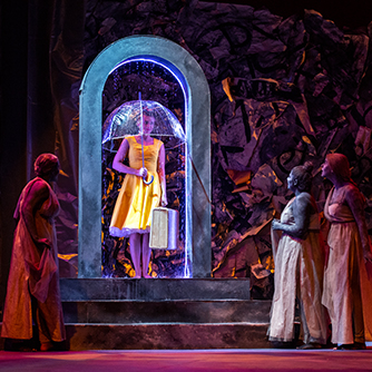 Students on stage performing a play