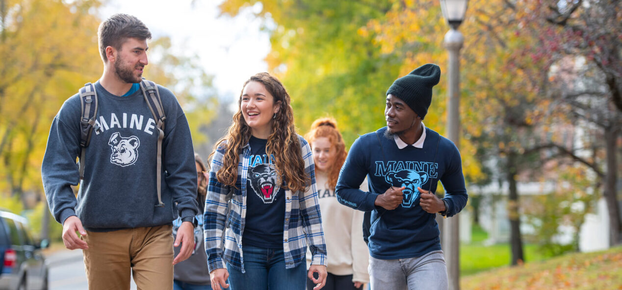 Male and female students walking to class