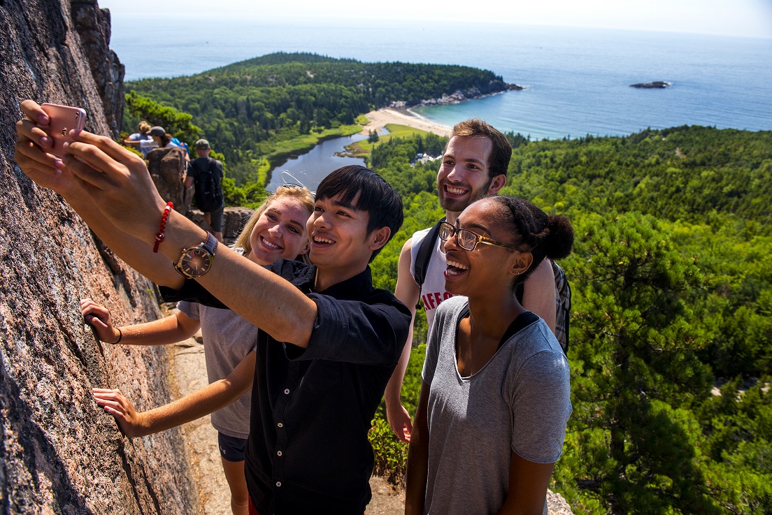 four students hiking