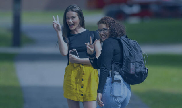 Women smiling on campus