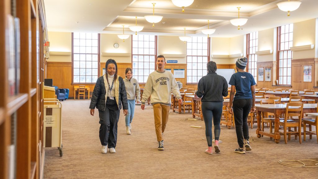 A photo of students walking through Fogler Library
