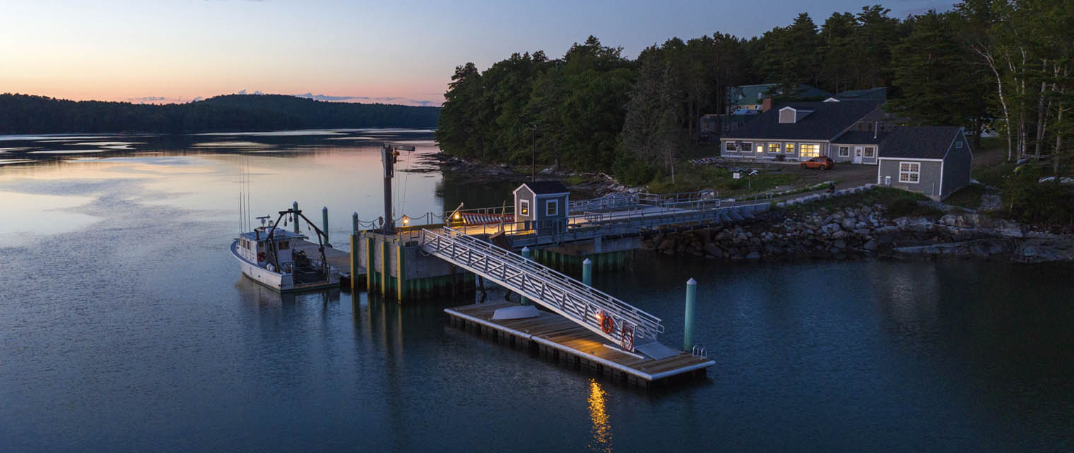 An aerial photo of the Darling Marine Center at dusk