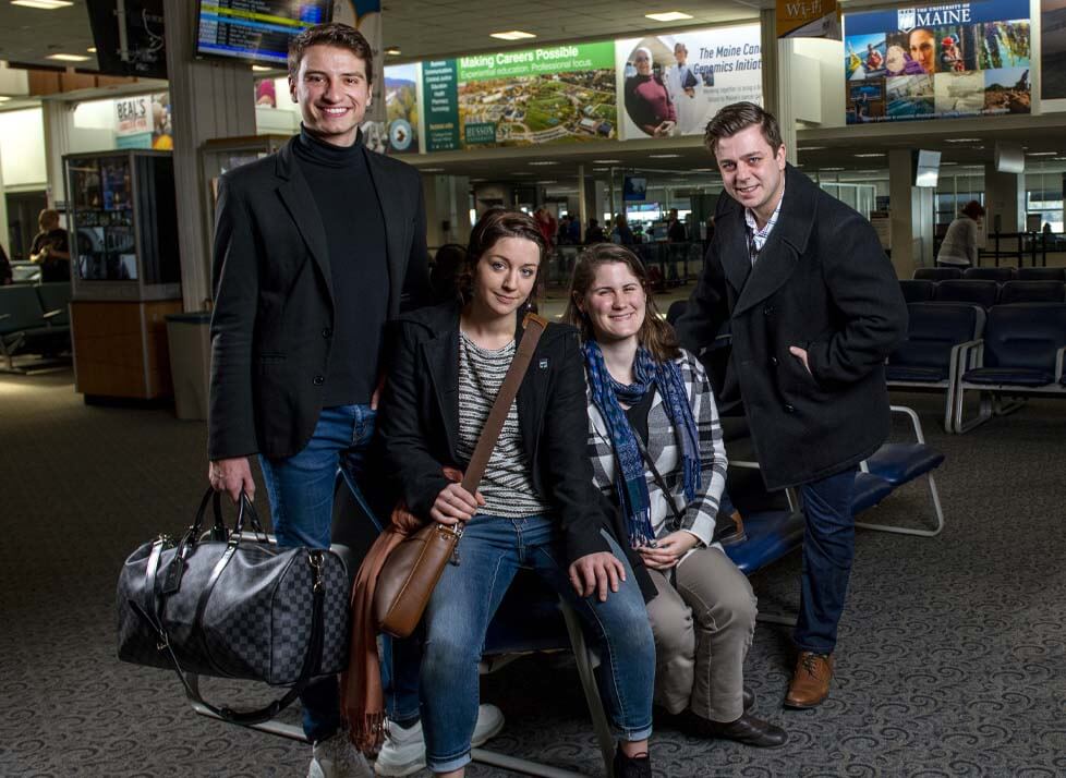 A photo of four international affairs students at Bangor International Airport