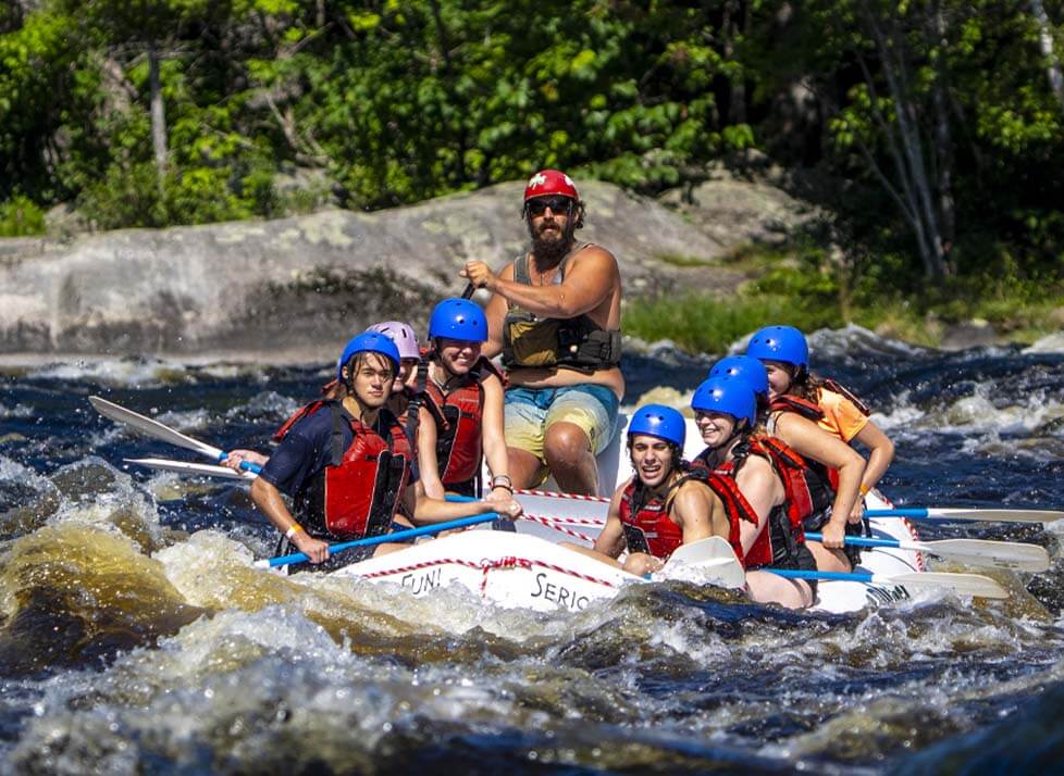 A photo of a group of people white water rafting 