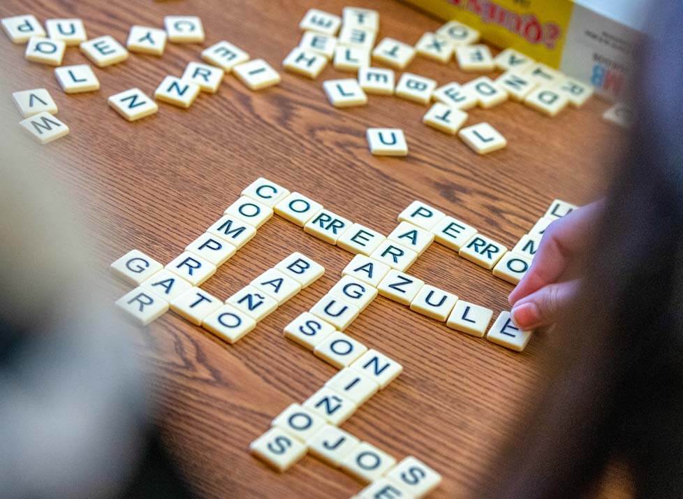 A photo of Spanish words spelled out with letter tiles