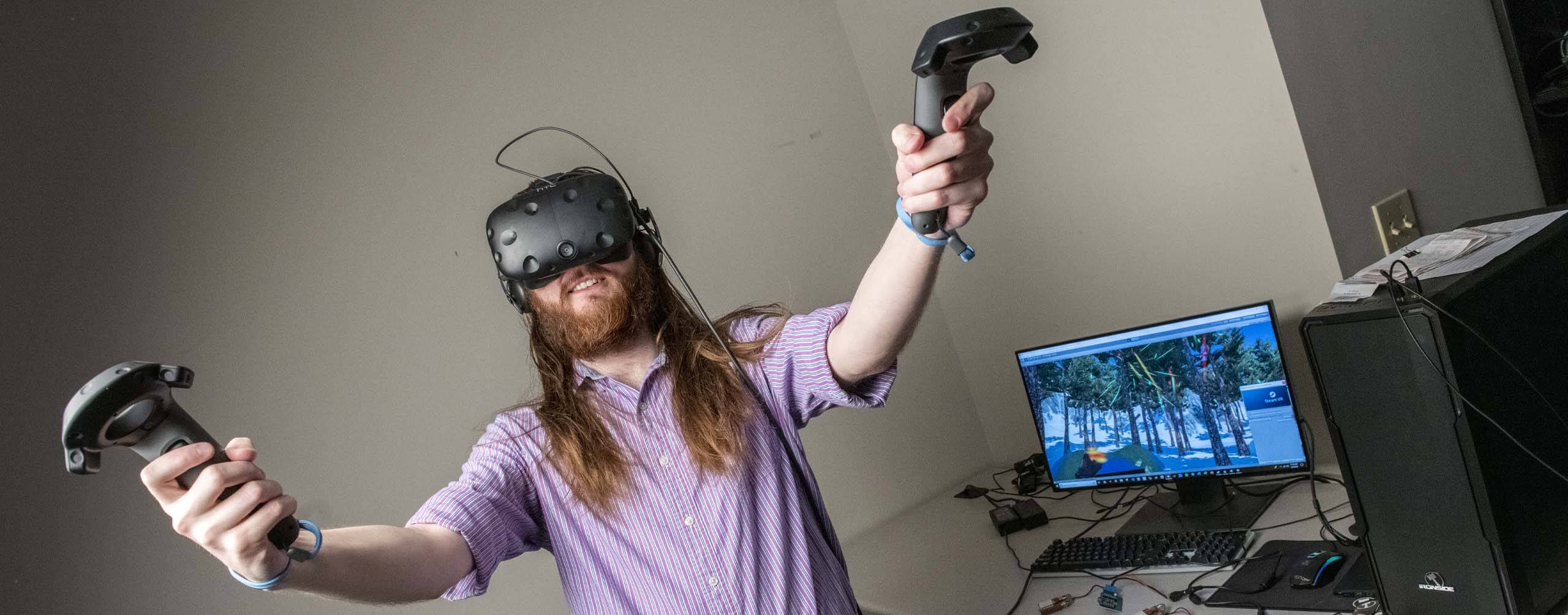 A photo of a person wearing a VR headset and holding conrollers