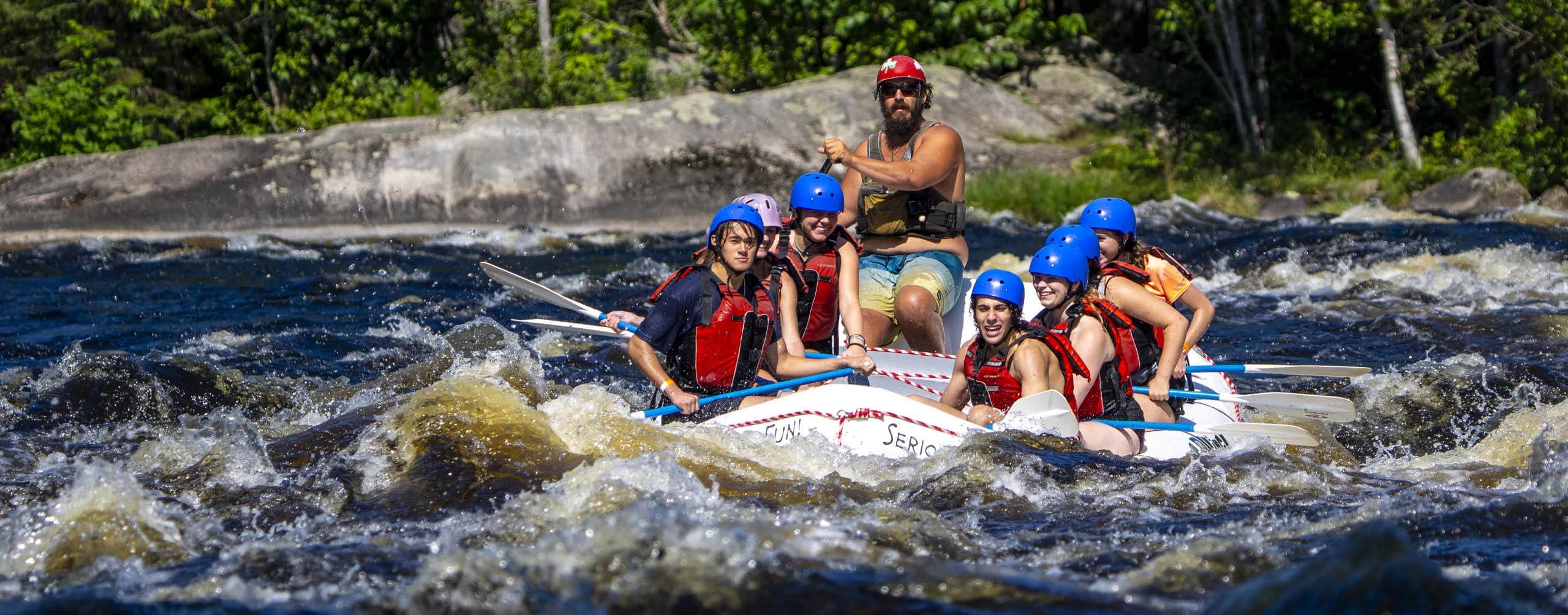 A photo of a group of people white water rafting