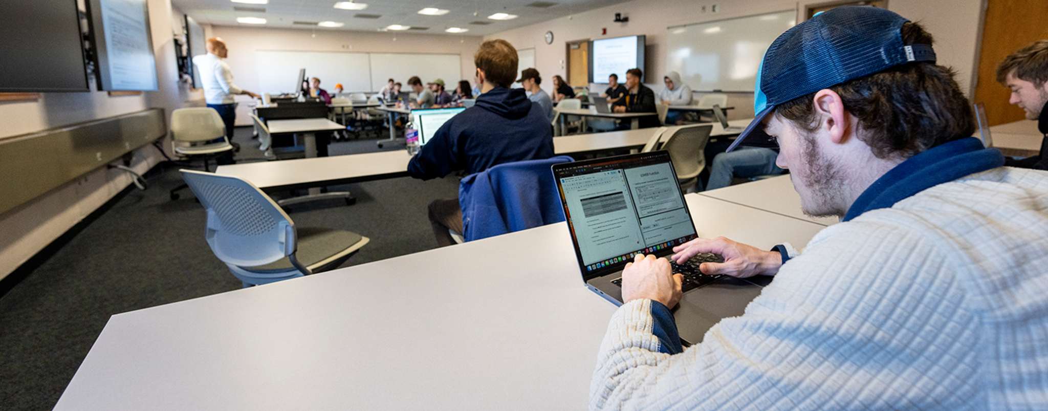 A photo of a student on a computer